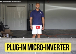Screenshot 2026-09-10 at 60622 PM - APsystems USA | The global leader in multi-platform MLPE technology - APsystems USA | The global leader in multi-platform MLPE technology Smiling man in a navy polo shirt stands in a cluttered garage; a large yellow sign reads 'Plug-In Micro-Inverter' in the foreground.